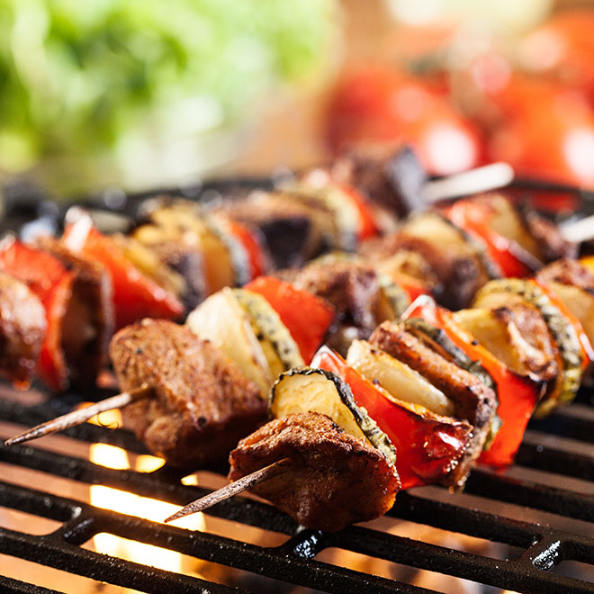 Grilling shashlik on barbecue grill. Selective focus